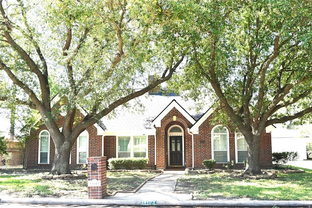 14103 Owens Rd, Houston, TX 77095 - view of front facade featuring brick siding and a shingled roof