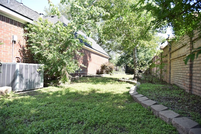 14103 Owens Rd, Houston, TX 77095 - view of grassy yard featuring central air condition unit