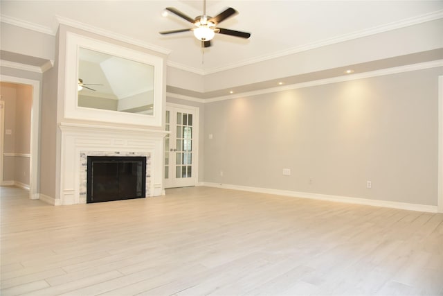14103 Owens Rd, Houston, TX 77095 - unfurnished living room featuring ceiling fan, light wood-style flooring, baseboards, a glass covered fireplace, and ornamental molding