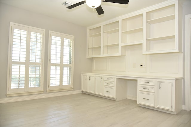 14103 Owens Rd, Houston, TX 77095 - unfurnished office featuring built in study area, a ceiling fan, baseboards, and healthy amount of natural light