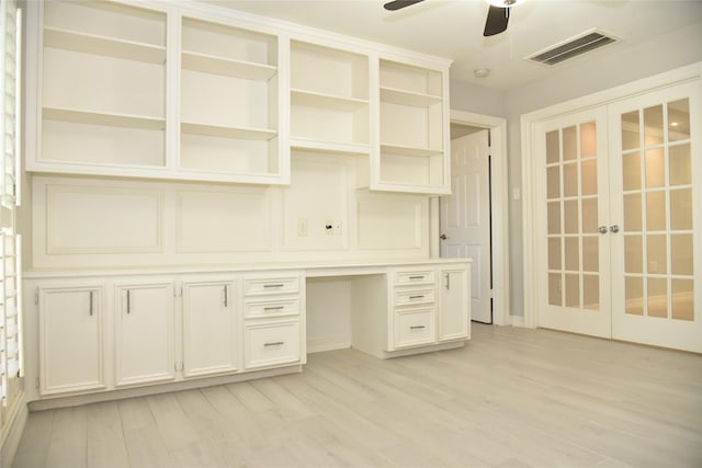 14103 Owens Rd, Houston, TX 77095 - unfurnished office with french doors, ceiling fan, built in desk, light wood-style flooring, and baseboards