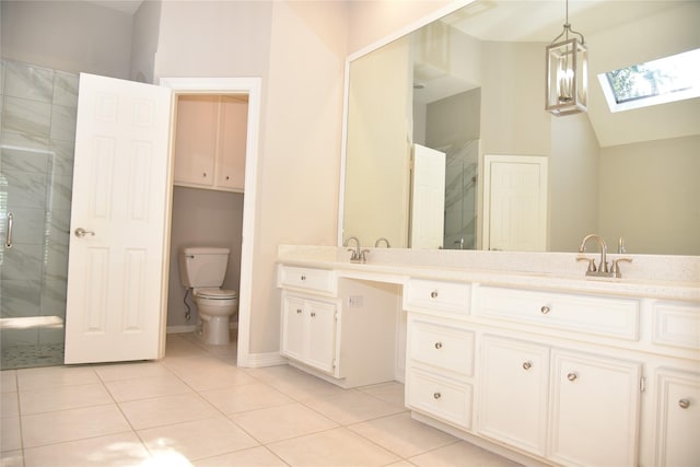 14103 Owens Rd, Houston, TX 77095 - bathroom with a skylight, double vanity, tile patterned floors, a shower stall, and toilet