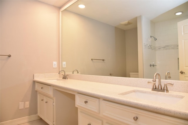 14103 Owens Rd, Houston, TX 77095 - full bath featuring double vanity, recessed lighting, toilet, a shower, and baseboards
