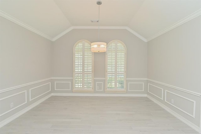 14103 Owens Rd, Houston, TX 77095 - unfurnished dining area featuring light wood-style floors, healthy amount of natural light, a wainscoted wall, ornamental molding, and a decorative wall