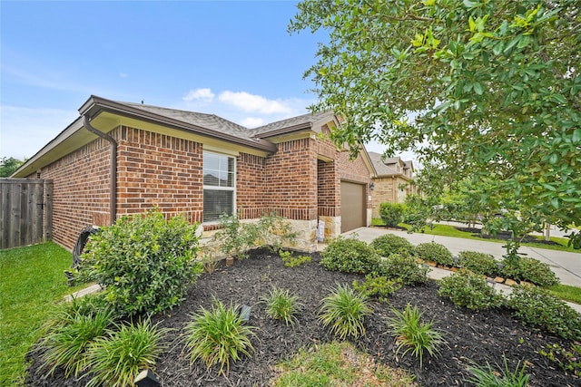 11607 Brookside Arbor Ln, Richmond, TX 77406 - view of front of property featuring brick siding, an attached garage, driveway, and roof with shingles