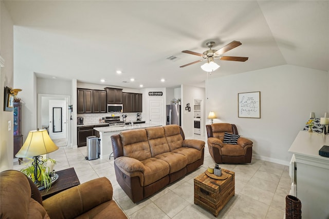 11607 Brookside Arbor Ln, Richmond, TX 77406 - living area featuring ceiling fan, light tile patterned flooring, recessed lighting, lofted ceiling, and baseboards