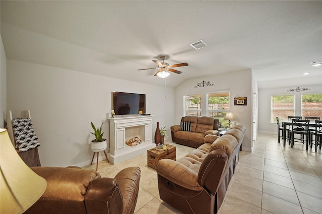 11607 Brookside Arbor Ln, Richmond, TX 77406 - living room with light tile patterned floors, a ceiling fan, plenty of natural light, baseboards, and vaulted ceiling