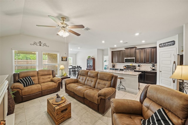11607 Brookside Arbor Ln, Richmond, TX 77406 - living room with light tile patterned floors, a ceiling fan, recessed lighting, and lofted ceiling