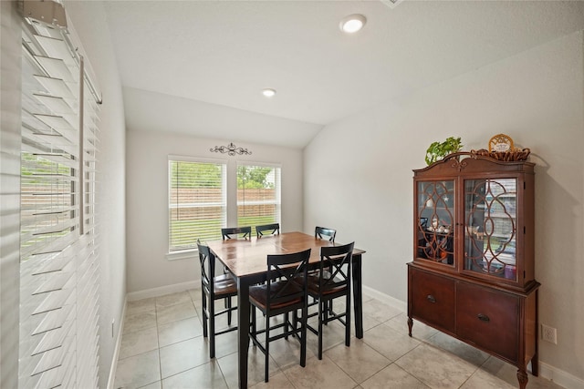 11607 Brookside Arbor Ln, Richmond, TX 77406 - dining area featuring vaulted ceiling, baseboards, light tile patterned floors, and recessed lighting