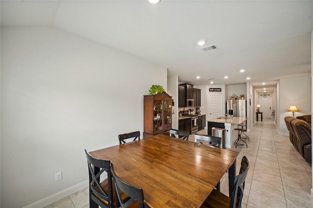 11607 Brookside Arbor Ln, Richmond, TX 77406 - dining space featuring light tile patterned floors, baseboards, and recessed lighting