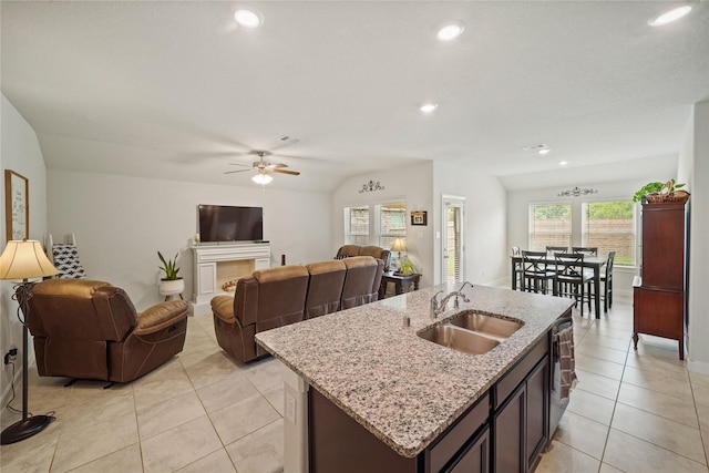11607 Brookside Arbor Ln, Richmond, TX 77406 - kitchen featuring a sink, light tile patterned flooring, open floor plan, a kitchen island with sink, and recessed lighting