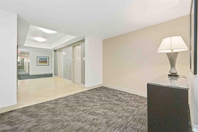 3505 Sage Rd Unit 1508, Houston, TX 77056 - corridor featuring a tray ceiling, baseboards, and carpet flooring