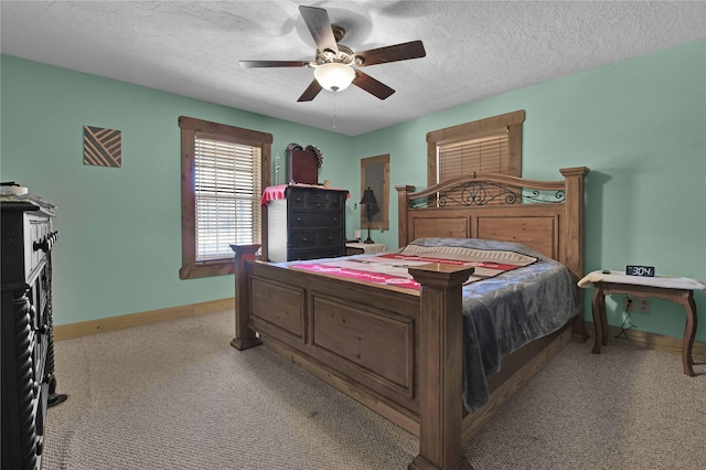 2000 E Beverly Dr, Shepherd, TX 77371 - bedroom featuring carpet floors, baseboards, a ceiling fan, and a textured ceiling