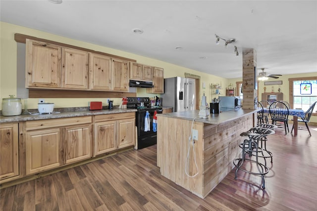 2000 E Beverly Dr, Shepherd, TX 77371 - kitchen with black / electric stove, stainless steel fridge, dark wood finished floors, and light brown cabinets