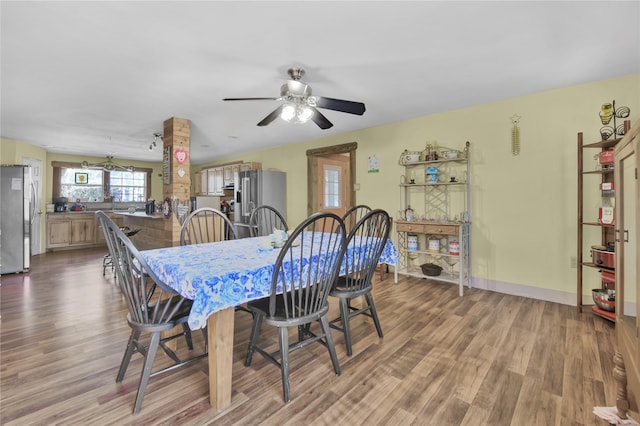 2000 E Beverly Dr, Shepherd, TX 77371 - dining room featuring wood finished floors, a ceiling fan, and baseboards