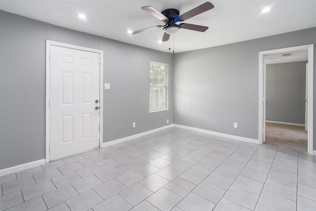 611 93rd St, Houston, TX 77012 - unfurnished room with a ceiling fan, baseboards, recessed lighting, and light tile patterned floors