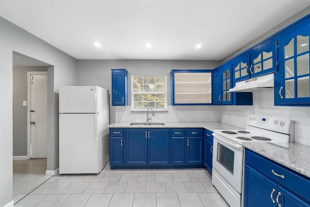 611 93rd St, Houston, TX 77012 - kitchen with white appliances, under cabinet range hood, a sink, blue cabinetry, and backsplash
