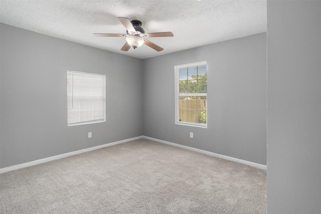 611 93rd St, Houston, TX 77012 - carpeted empty room featuring a ceiling fan, a textured ceiling, and baseboards