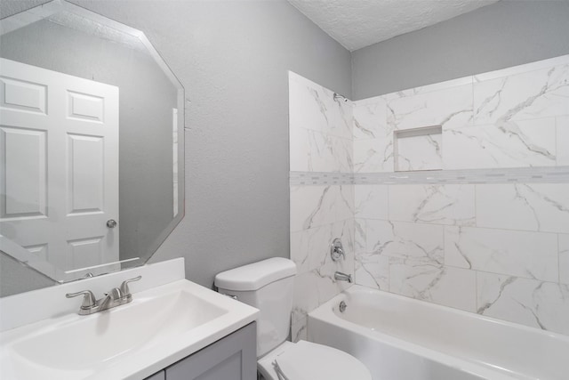 611 93rd St, Houston, TX 77012 - full bathroom featuring toilet, vanity, shower / washtub combination, a textured ceiling, and a textured wall