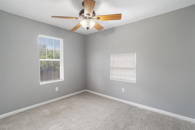 611 93rd St, Houston, TX 77012 - carpeted spare room featuring ceiling fan and baseboards