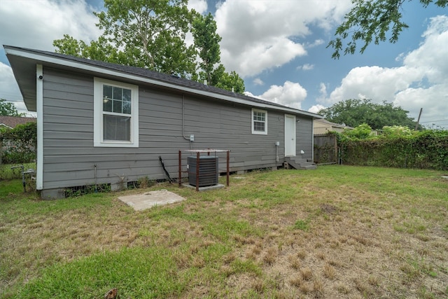 611 93rd St, Houston, TX 77012 - back of house with central AC unit and entry steps