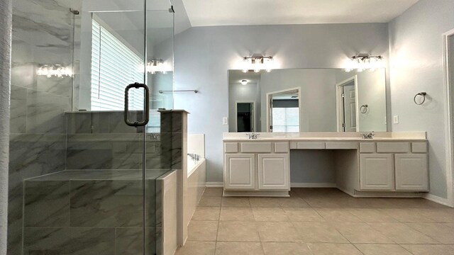 8106 Saragosa Blue Ln, Richmond, TX 77407 - bathroom featuring double vanity, a garden tub, a stall shower, tile patterned floors, and baseboards