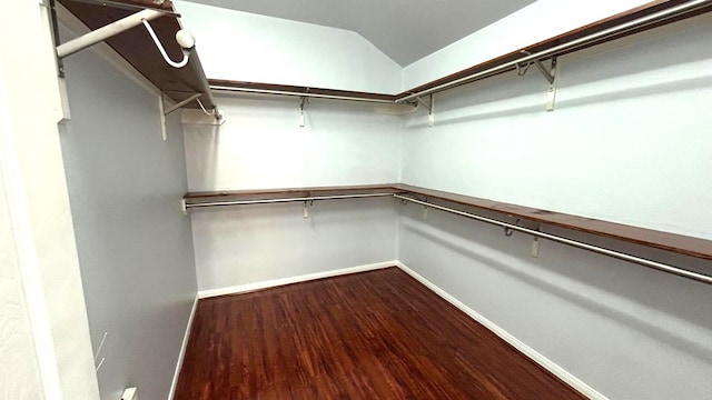 8106 Saragosa Blue Ln, Richmond, TX 77407 - spacious closet featuring dark wood-type flooring and vaulted ceiling