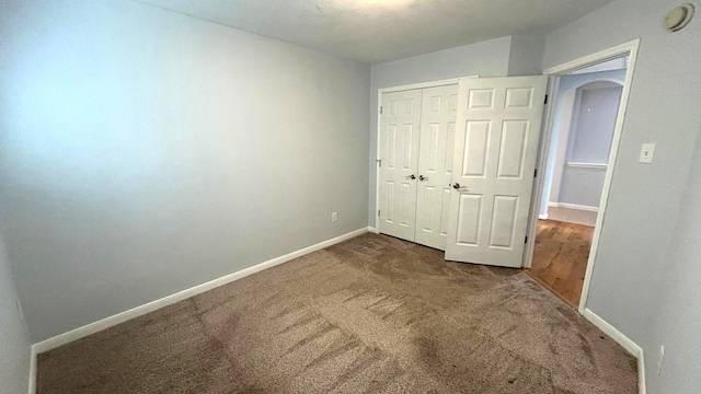 8106 Saragosa Blue Ln, Richmond, TX 77407 - unfurnished bedroom with carpet, a closet, and baseboards