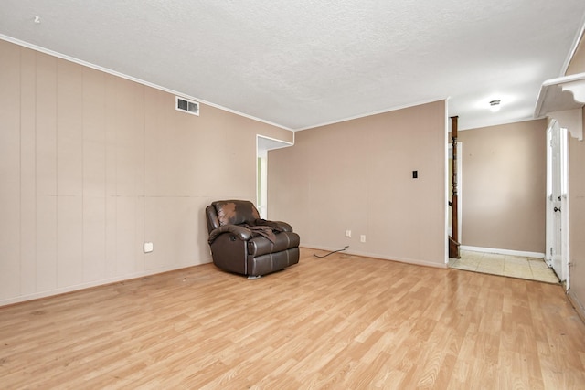 203 Kirkaldy Dr, Houston, TX 77015 - unfurnished room with light wood finished floors, a textured ceiling, baseboards, and crown molding