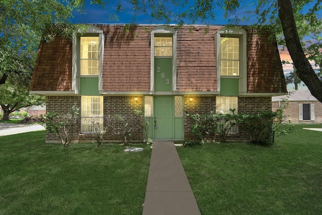 203 Kirkaldy Dr, Houston, TX 77015 - front of property with brick siding, mansard roof, and a front yard