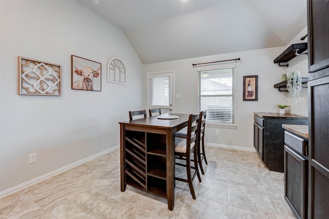 16715 Peralta Bay Cir, Crosby, TX 77532 - dining space with vaulted ceiling and baseboards