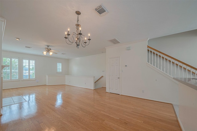 1715 Hadley St, Houston, TX 77003 - unfurnished room with a chandelier, light wood-type flooring, ceiling fan, and baseboards