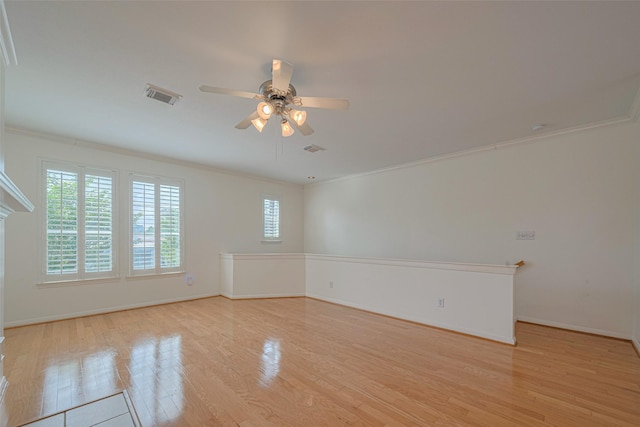 1715 Hadley St, Houston, TX 77003 - unfurnished room with crown molding, light wood-type flooring, a ceiling fan, and baseboards