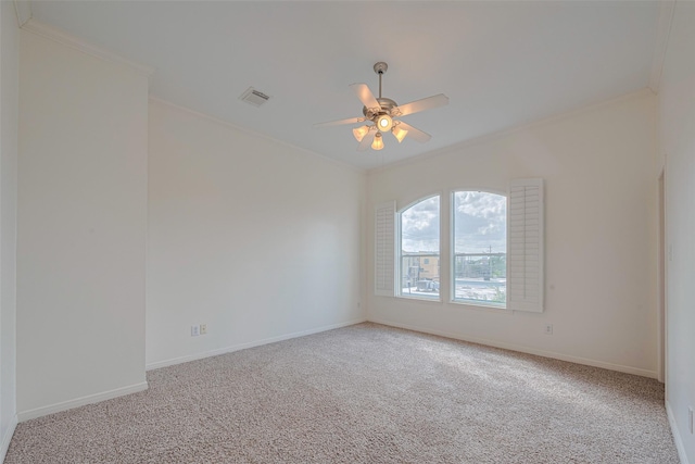1715 Hadley St, Houston, TX 77003 - spare room with crown molding, light colored carpet, ceiling fan, and baseboards