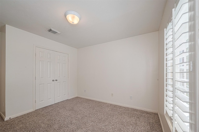 1715 Hadley St, Houston, TX 77003 - unfurnished bedroom with carpet floors, a closet, and baseboards