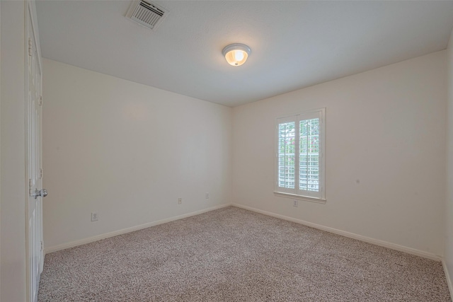1715 Hadley St, Houston, TX 77003 - carpeted empty room with baseboards