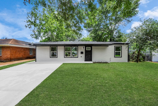 11503 Duane St, Houston, TX 77047 - view of front of house featuring a front lawn, concrete driveway, and stucco siding