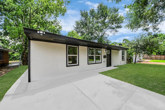 11503 Duane St, Houston, TX 77047 - mid-century modern home featuring a patio area and stucco siding