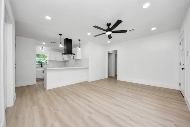 11503 Duane St, Houston, TX 77047 - unfurnished living room featuring a ceiling fan, recessed lighting, light wood-type flooring, and baseboards
