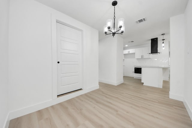 11503 Duane St, Houston, TX 77047 - unfurnished dining area featuring a chandelier, baseboards, light wood-style flooring, and recessed lighting