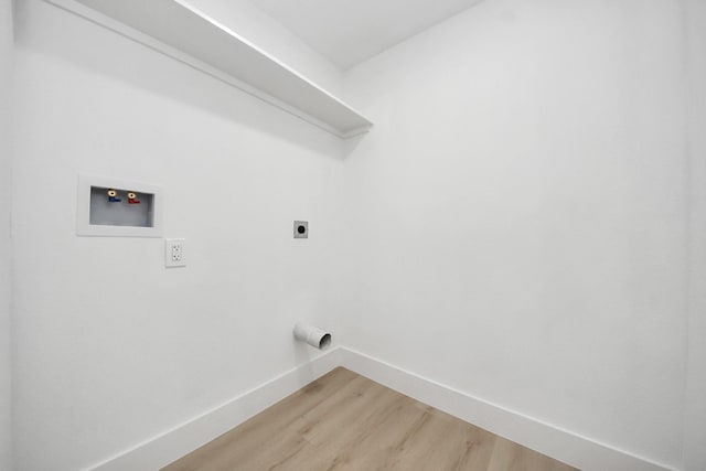 11503 Duane St, Houston, TX 77047 - laundry room featuring hookup for an electric dryer, baseboards, light wood-type flooring, and hookup for a washing machine