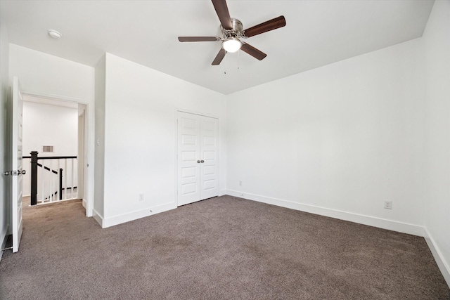 5041 Mallow St, Houston, TX 77033 - unfurnished bedroom with dark colored carpet, baseboards, and a closet