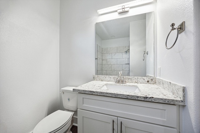 5041 Mallow St, Houston, TX 77033 - bathroom with toilet, vanity, and a tile shower