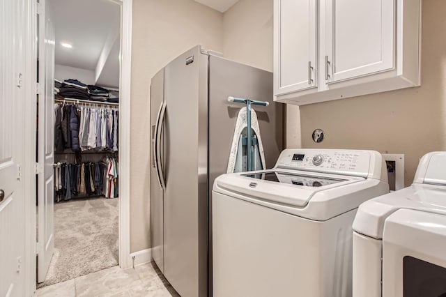 502 Pearl View Ln, Pinehurst, TX 77362 - laundry area featuring cabinet space and washing machine and dryer