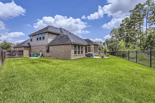 502 Pearl View Ln, Pinehurst, TX 77362 - rear view of property featuring brick siding, a patio area, a shingled roof, and cooling unit