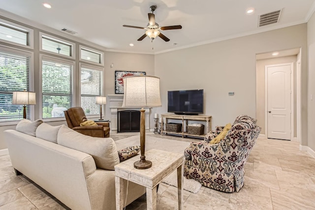 502 Pearl View Ln, Pinehurst, TX 77362 - living room with ceiling fan, baseboards, ornamental molding, recessed lighting, and a fireplace