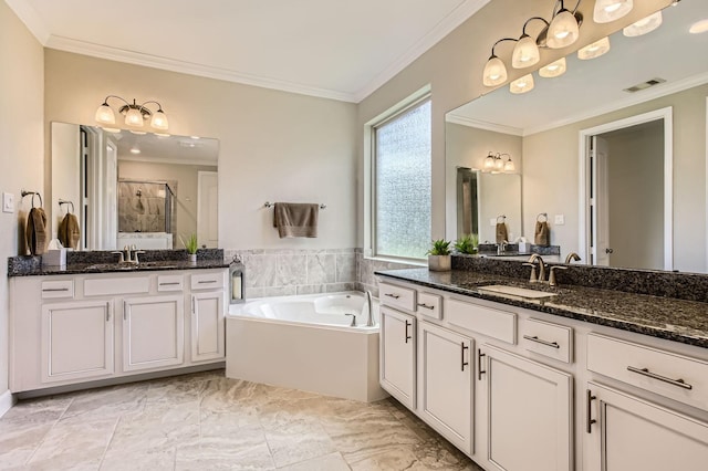 502 Pearl View Ln, Pinehurst, TX 77362 - full bath featuring a stall shower, crown molding, two vanities, a garden tub, and marble finish floors
