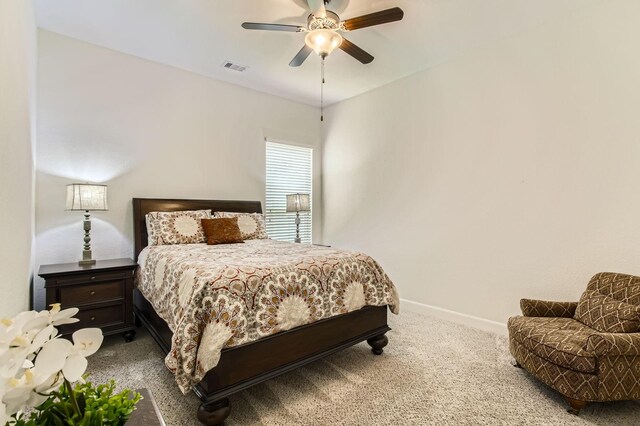 502 Pearl View Ln, Pinehurst, TX 77362 - carpeted bedroom featuring baseboards and a ceiling fan