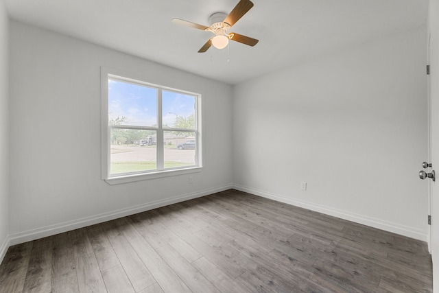 7414 Sunlight Ln, Houston, TX 77095 - empty room featuring wood finished floors, ceiling fan, and baseboards