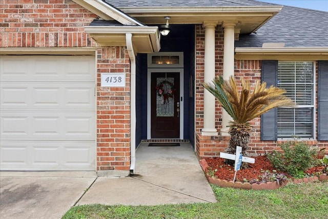 4138 Willow Bend Ln, Port Arthur, TX 77642 - entrance to property featuring brick siding, a shingled roof, and a garage